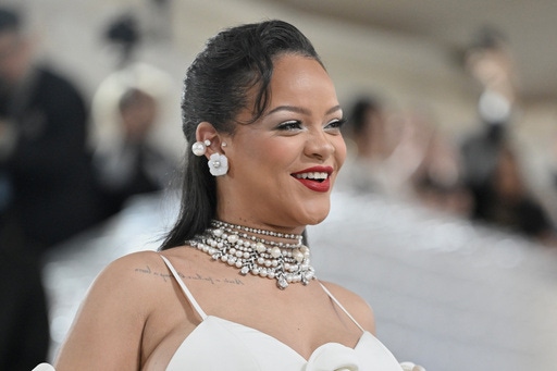 FILE - Rihanna shows off her baby bump at The Metropolitan Museum of Art's Costume Institute benefit gala celebrating the opening of the "Karl Lagerfeld: A Line of Beauty" exhibition on Monday, May 1, 2023, in New York. (Photo by Evan Agostini/Invision/AP, File)